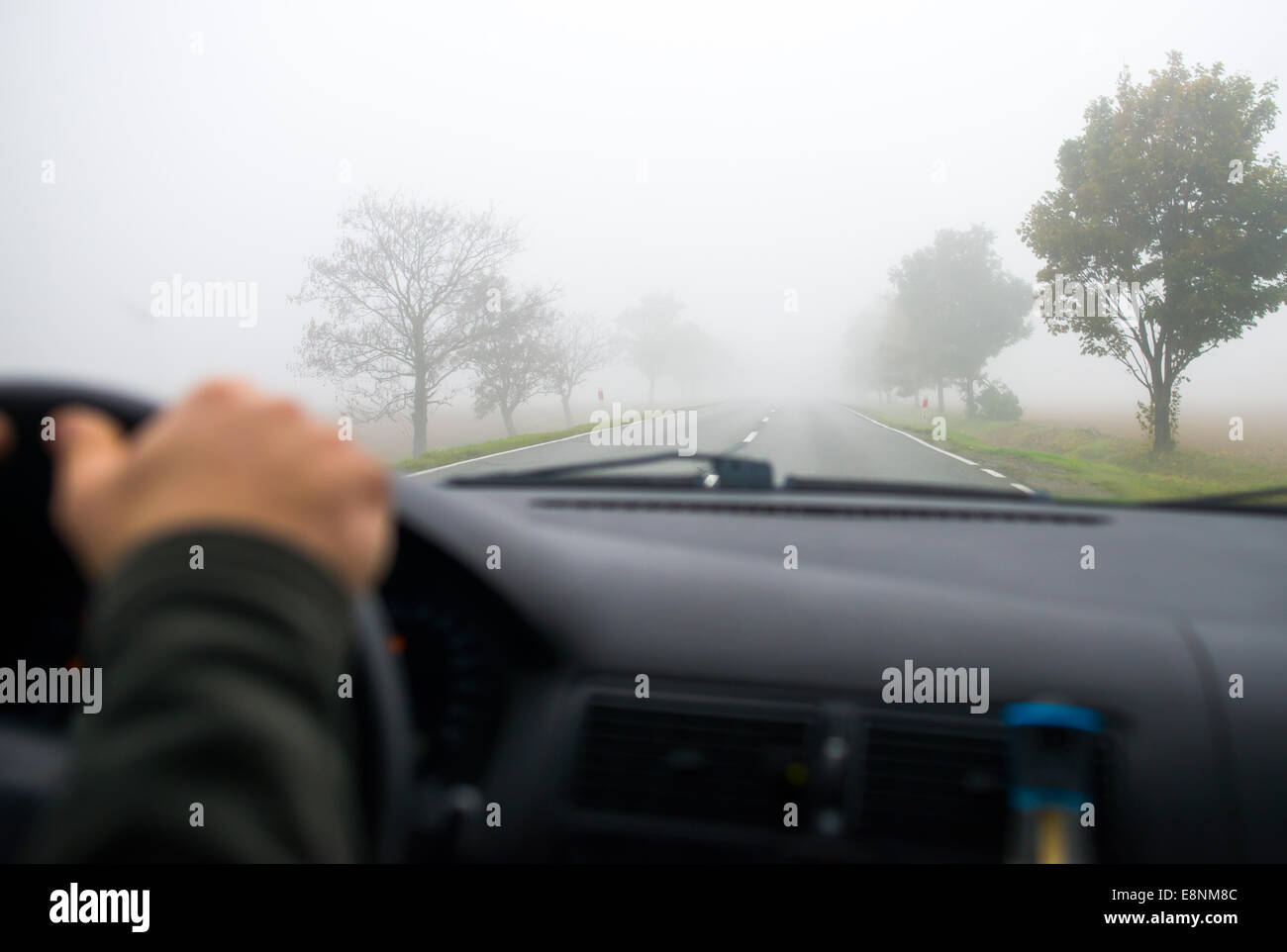 Car driving in the Fog Road Stock Photo - Alamy