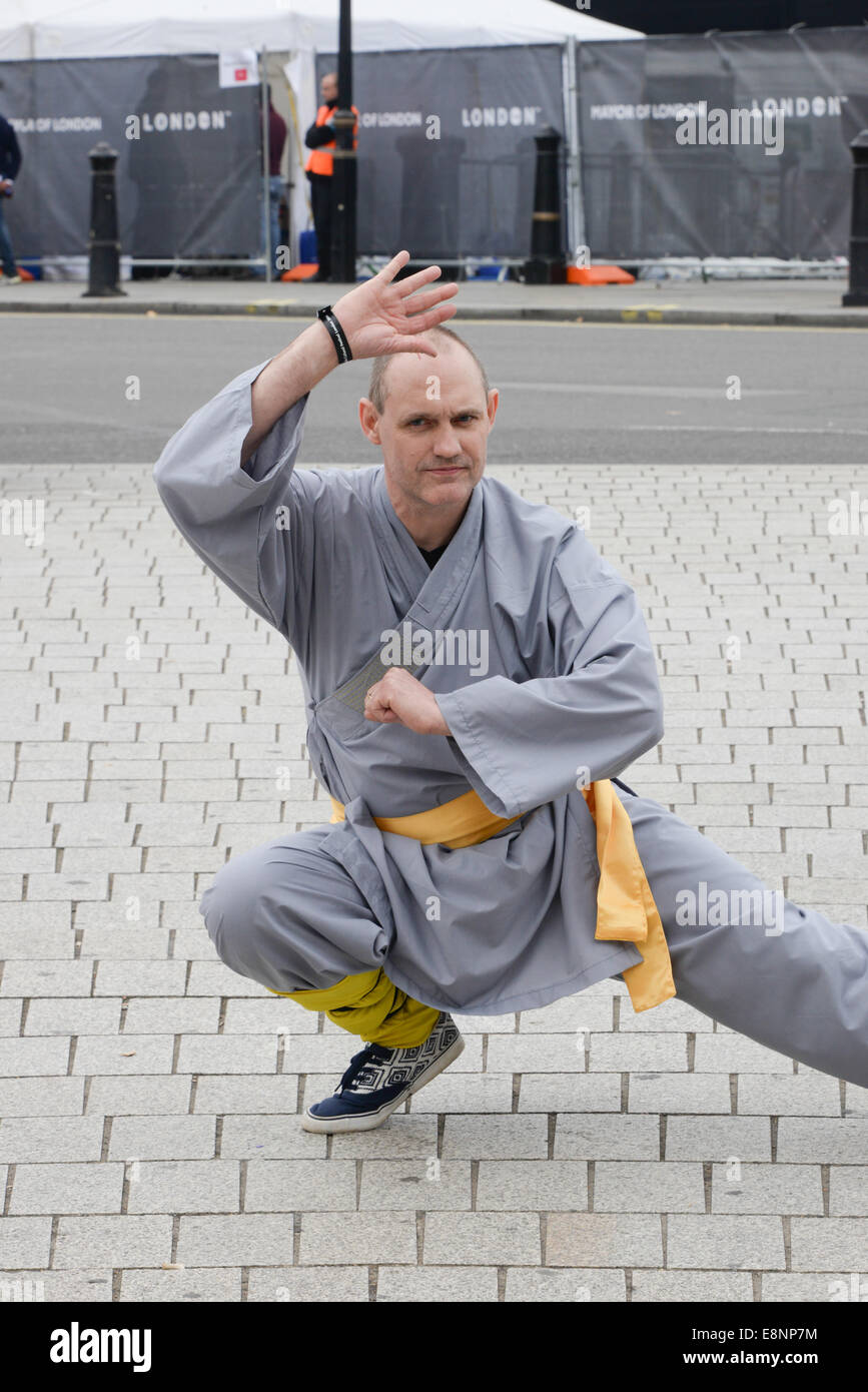 London, UK. 12th October, 2014. Bristol Shaolin monks passing by Trafalgar Square after visiting the 3rd Edition of Shaolin at London Soccerdome in London. Credit:  See Li/Alamy Live News Stock Photo