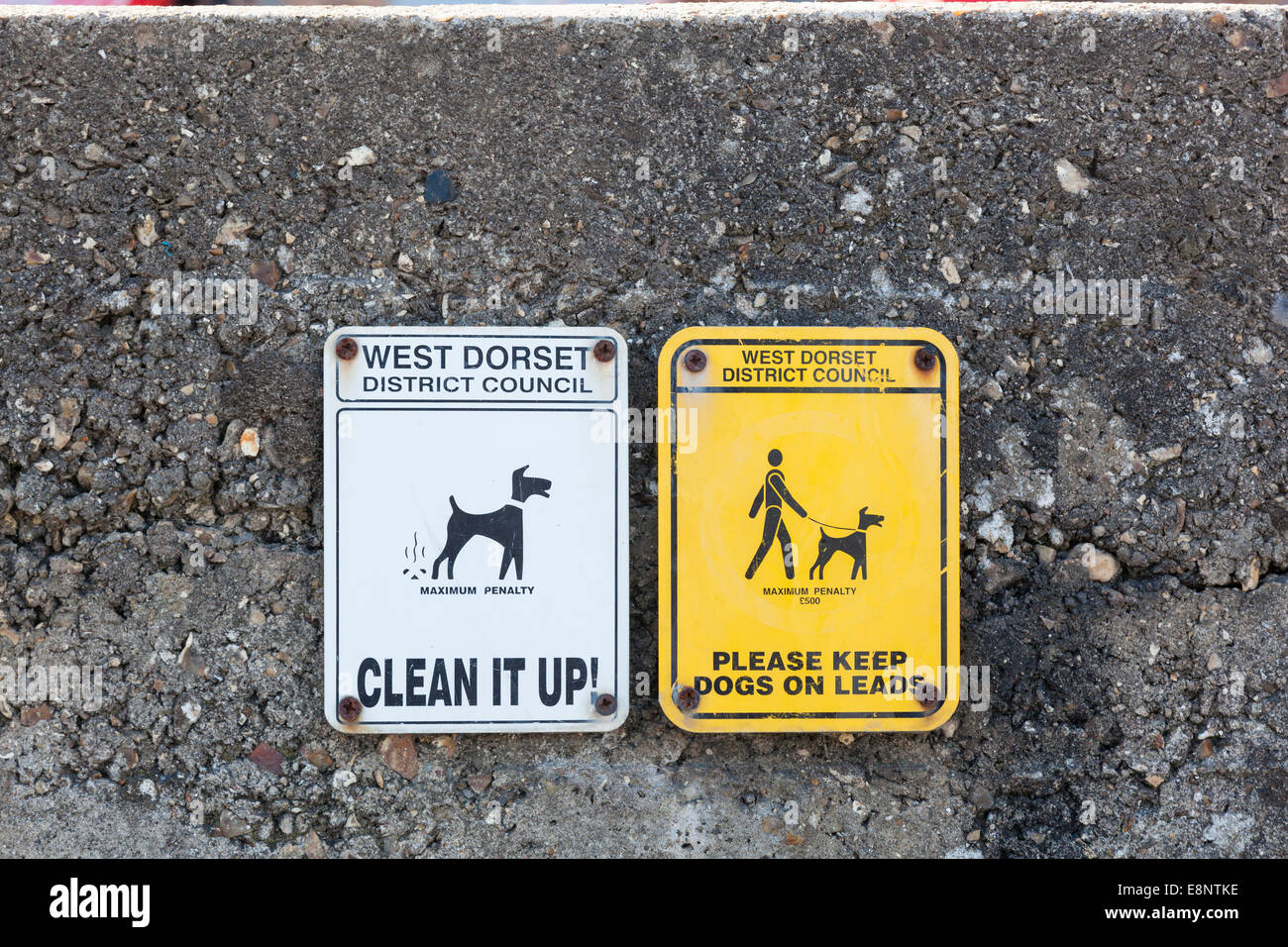 Council warning notices to dog owners regarding penalties for their dogs fouling and not being on a lead. Stock Photo