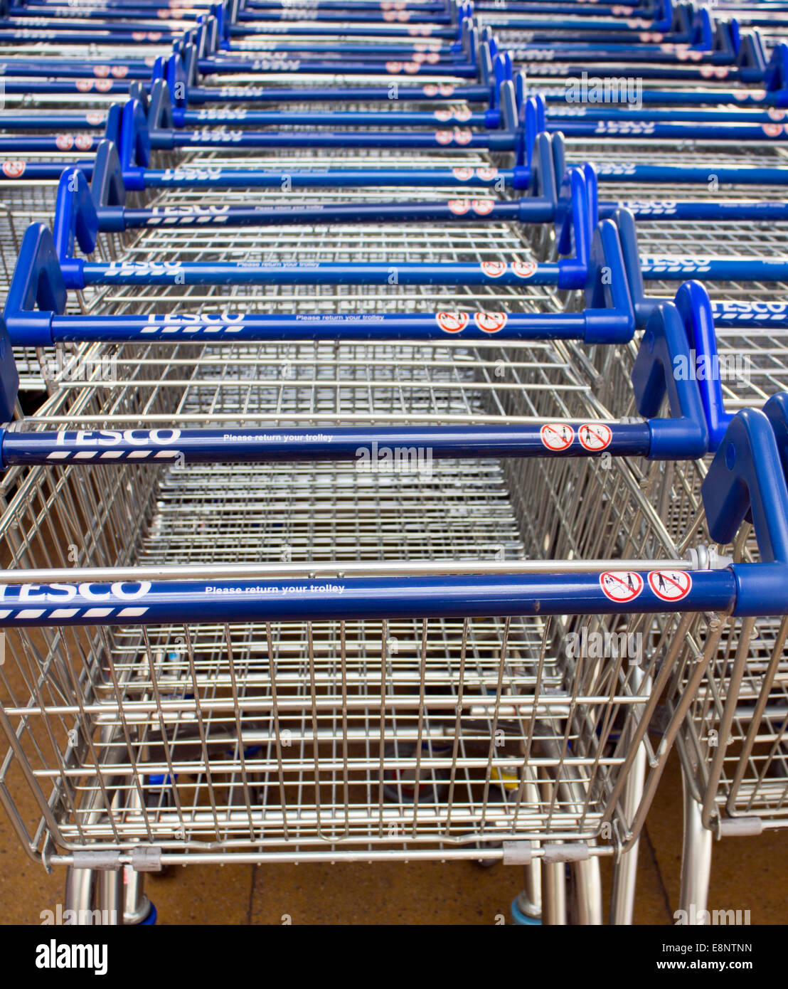 Shallow focus image of Tesco shopping trolleys Stock Photo