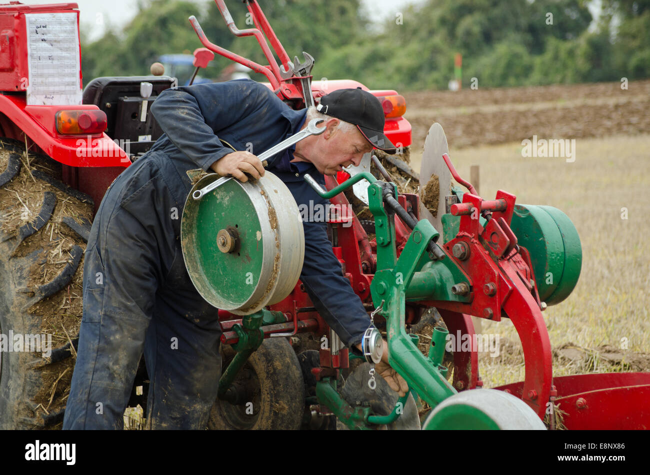 David Chappell making adjustments at British National Ploughing Championships 2014 Stock Photo