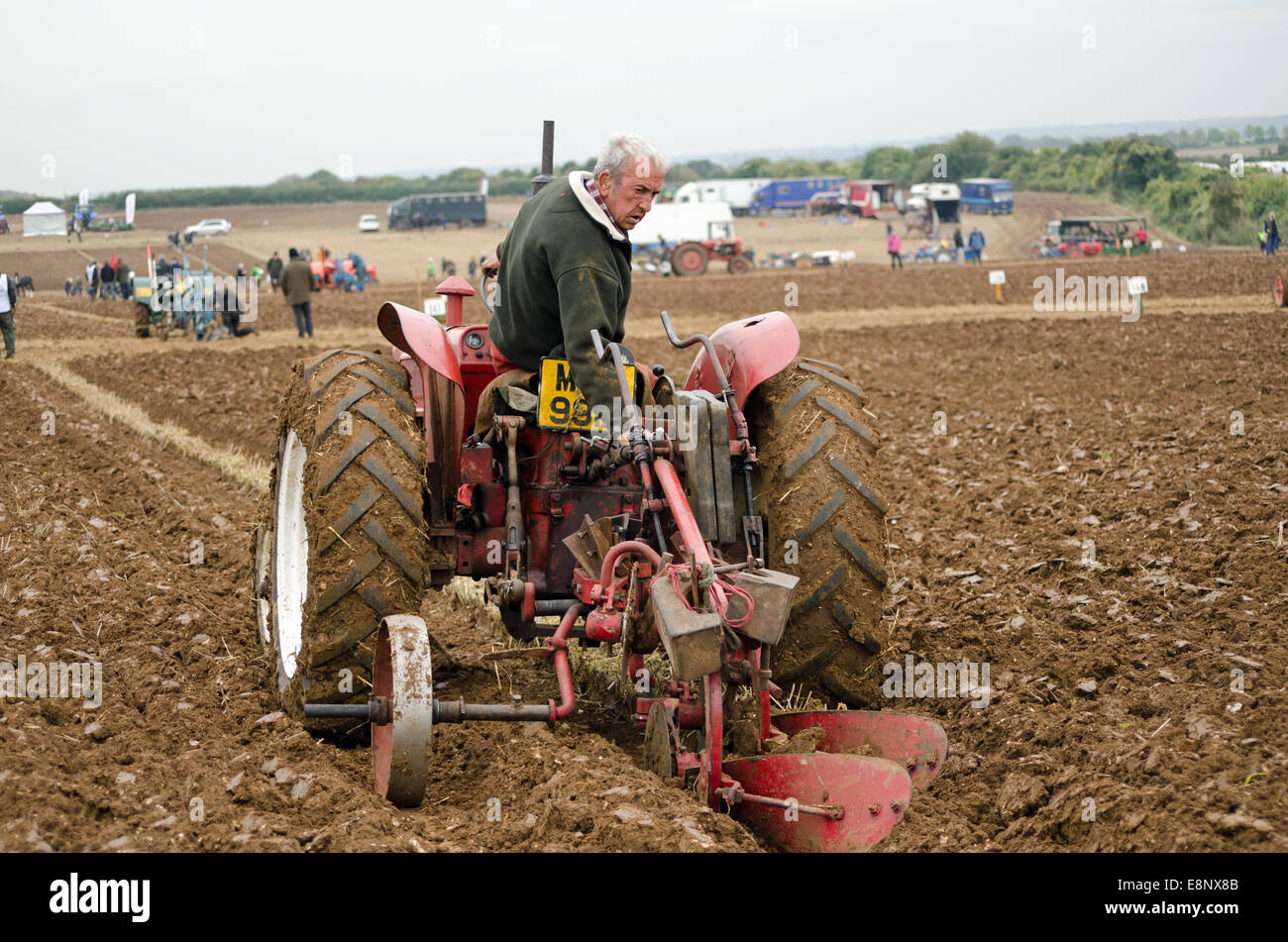 BASINGSTOKE, UK  OCTOBER 12, 2014: A competitor adjusting his equipment during the British National Ploughing Championship. Stock Photo
