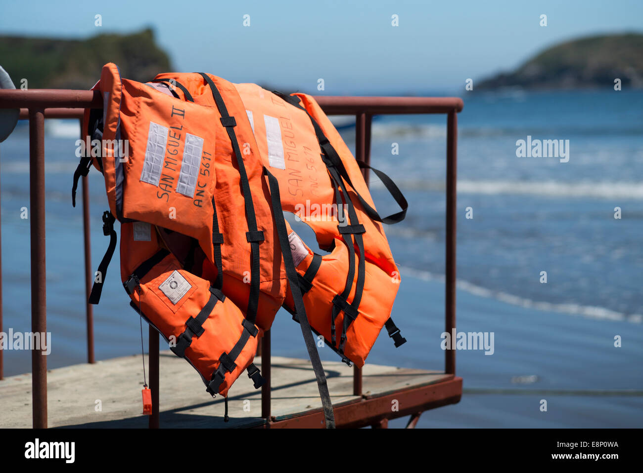 Life-jacket on the beach ready for use. Stock Photo