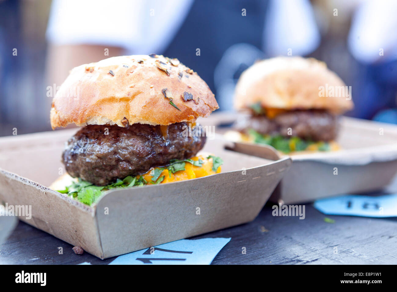 Fresh two tasty burgers with beef in paper take away box Stock Photo