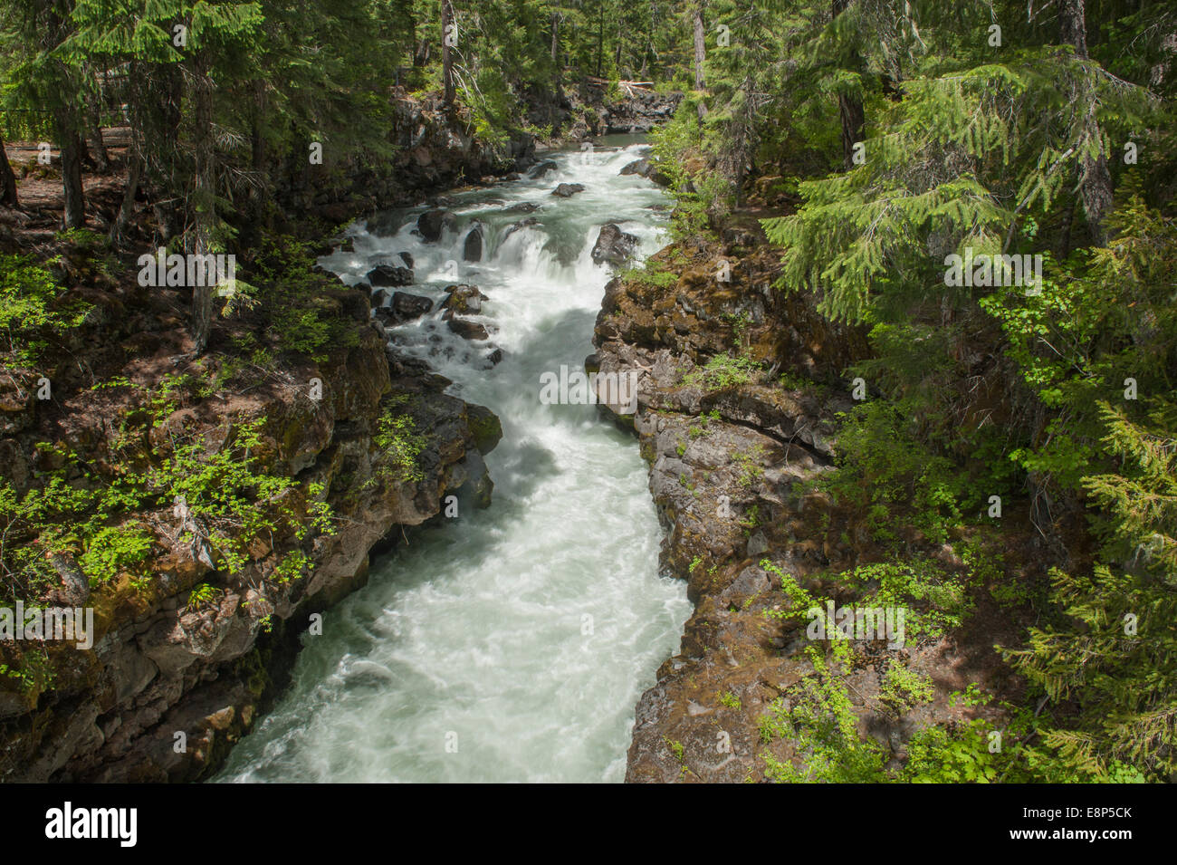 A portion of the upper Rogue River in Oregon, just below the Natural Bridge, during its yearly peak flow Stock Photo