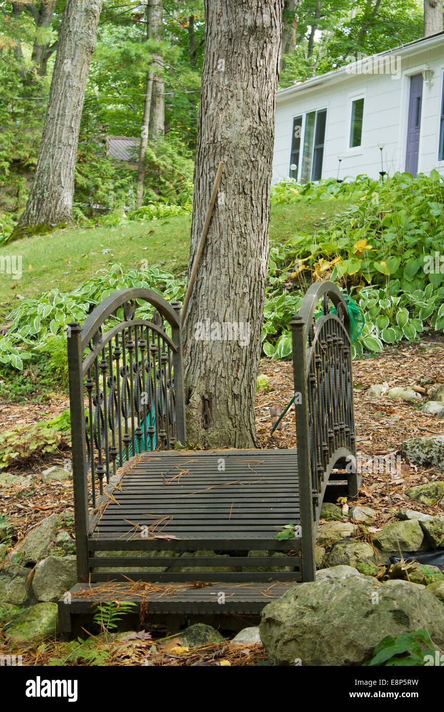 Carved Wooden Bridge Over A Culvert At A Cottage In Grand Bend