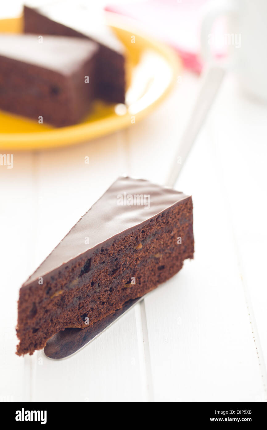 one piece of sacher cake on table Stock Photo
