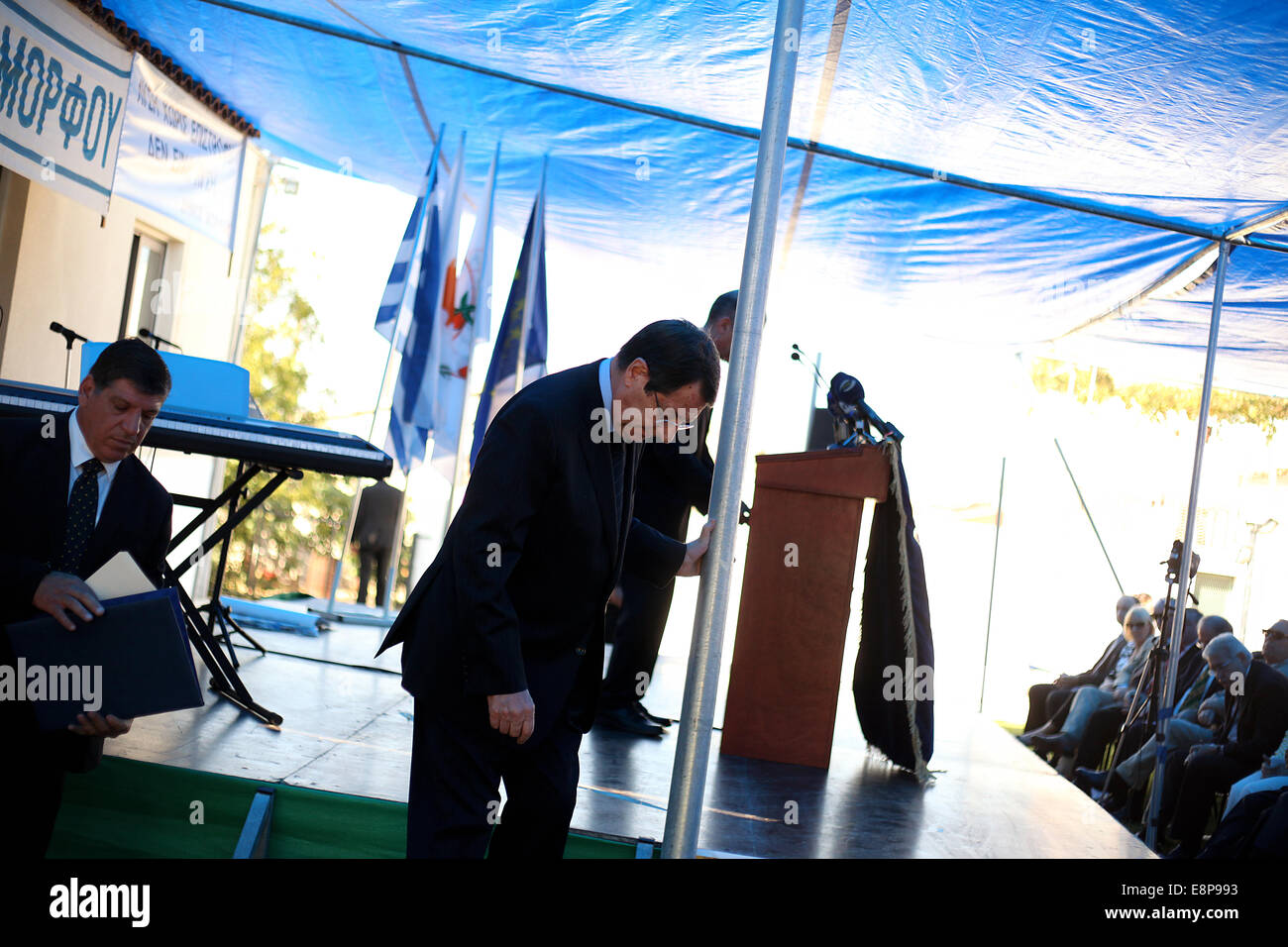 Astromeritis, Cyprus. 12th Oct, 2014. President of Cyprus Nicos Anastasiadis descends from the stage after his speech during the anti-occupation event of Morfou municipality in Astromeritys Village. The anti-occupation commemoration yearly was held in Morfou municipality after its Turkish invasion in 1974. Credit:  Yiorgos Doukanaris/Pacific Press/Alamy Live News Stock Photo