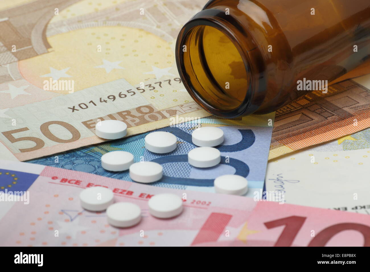 Pills and banknotes Stock Photo