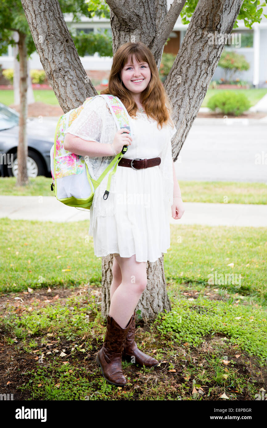 Portrait of teenage girl (13-15) with backpack Stock Photo