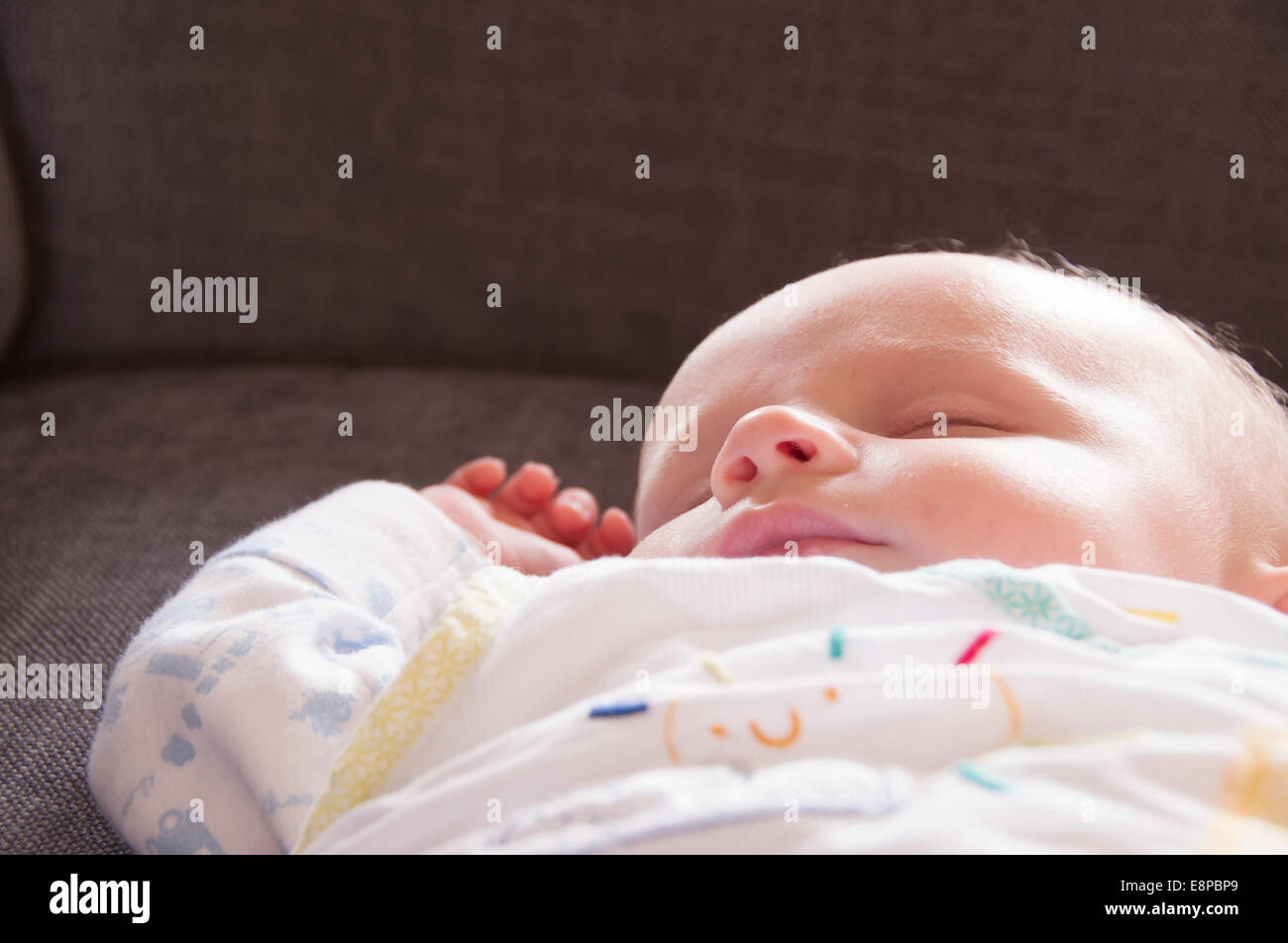 Baby boy sleeping on a sofa Stock Photo Alamy