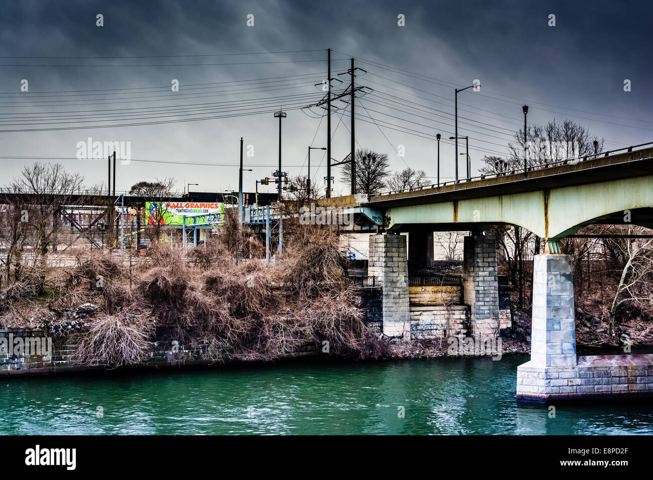 Dark clouds over a bridge over the Schuylkill River in Philadelphia, Pennsylvania. Stock Photo