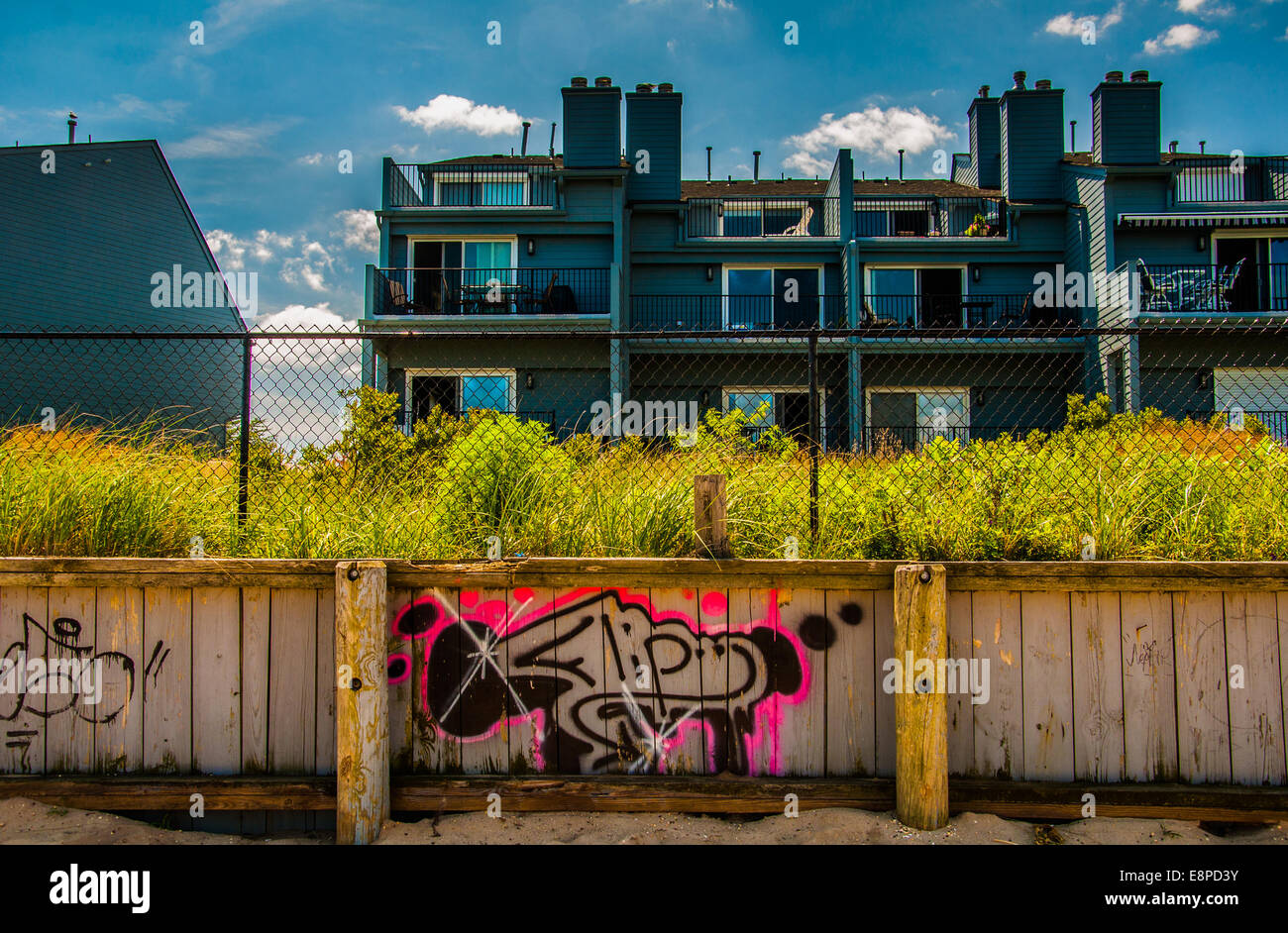 Graffiti on wooden fence in front of waterfronts condos in Point Pleasant Beach, New Jersey. Stock Photo