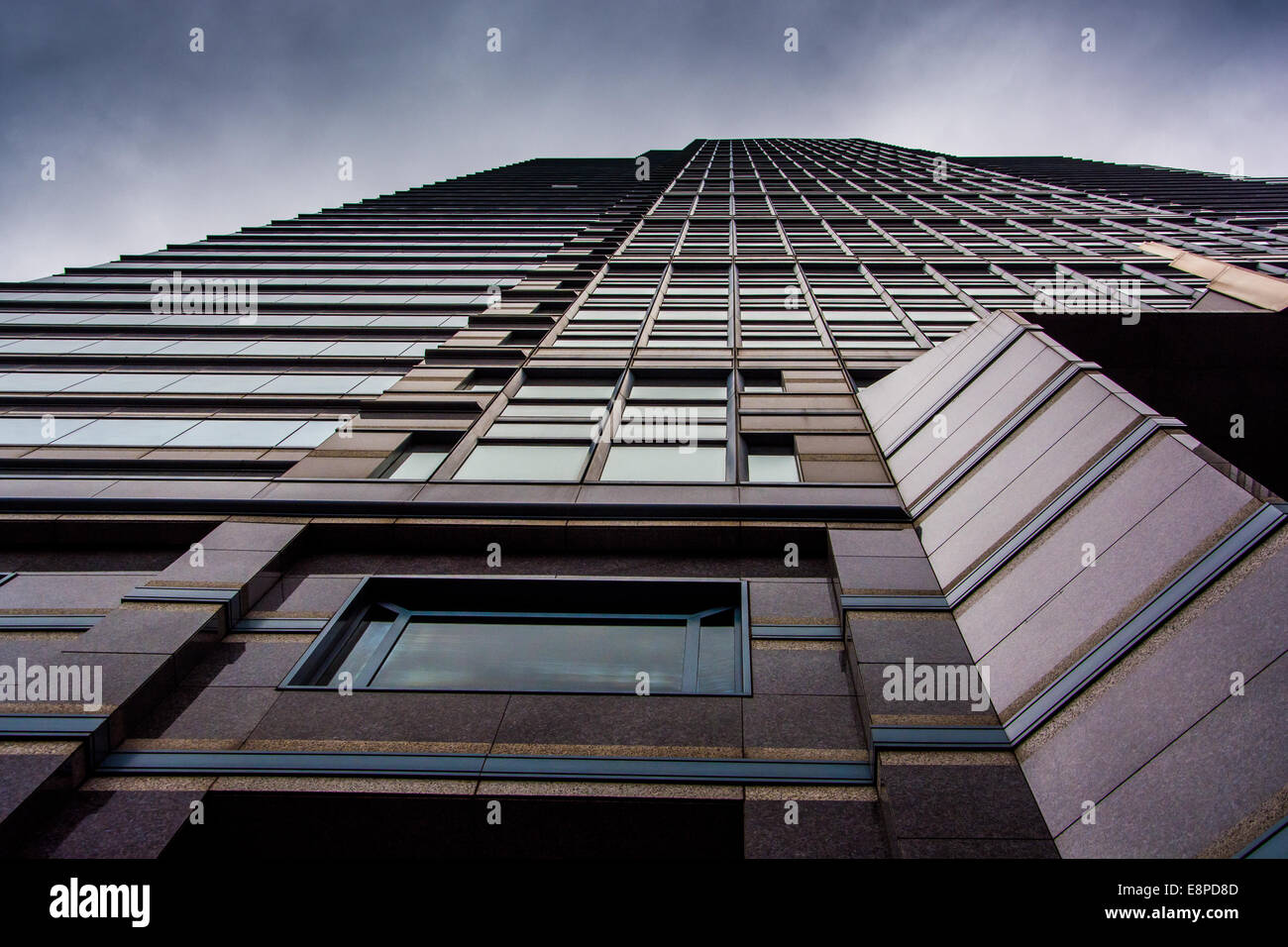 Looking up at a modern building under a cloudy sky in Philadelphia ...