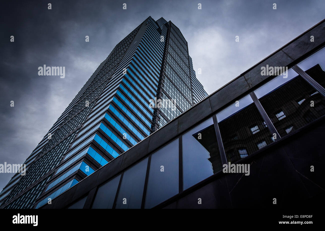 Looking up at a modern building under a cloudy sky in Philadelphia ...