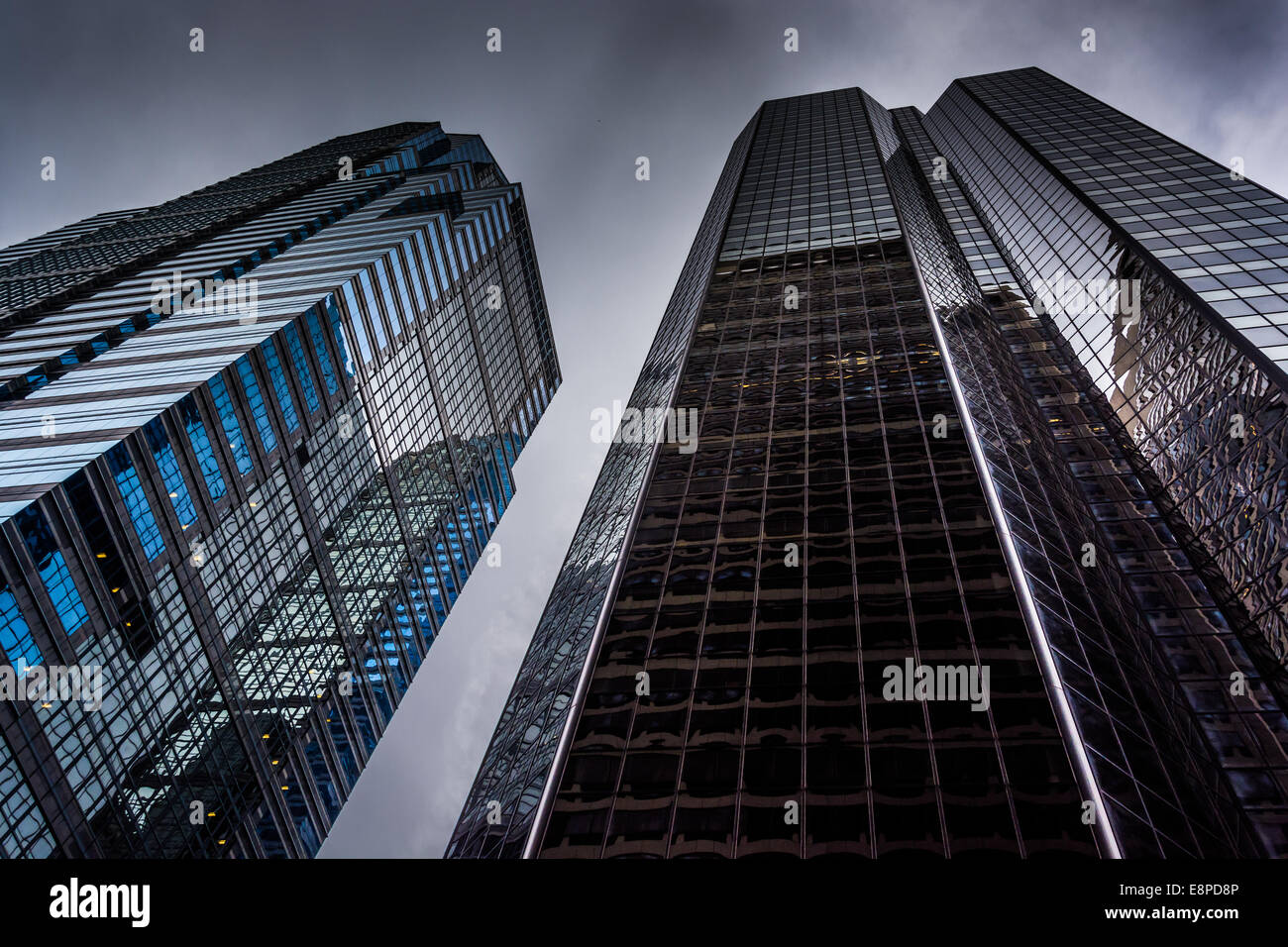 Looking up at modern buildings under a cloudy sky in Philadelphia ...