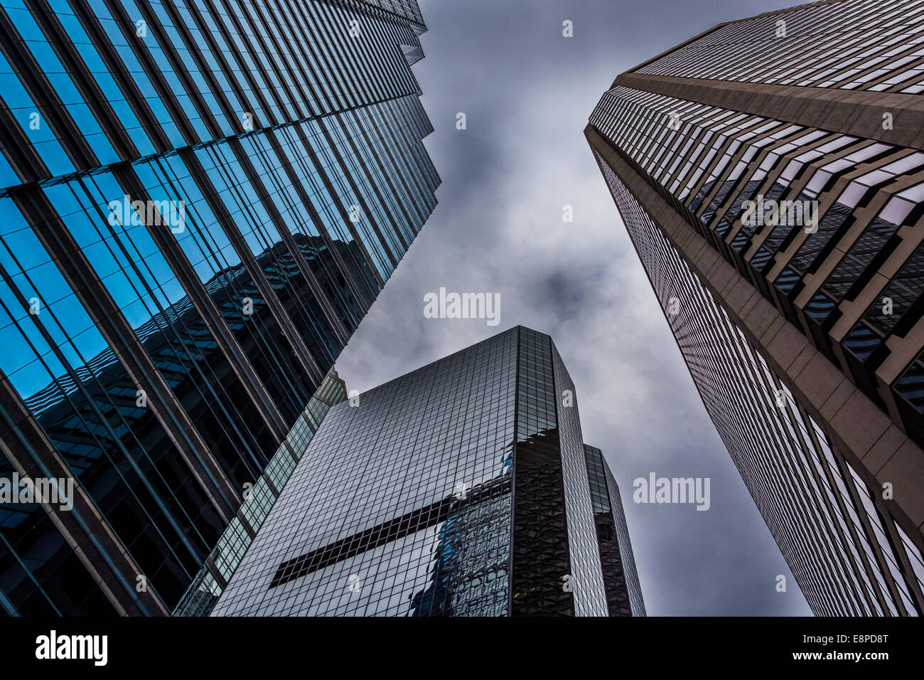 Looking up at modern buildings under a cloudy sky in Philadelphia ...