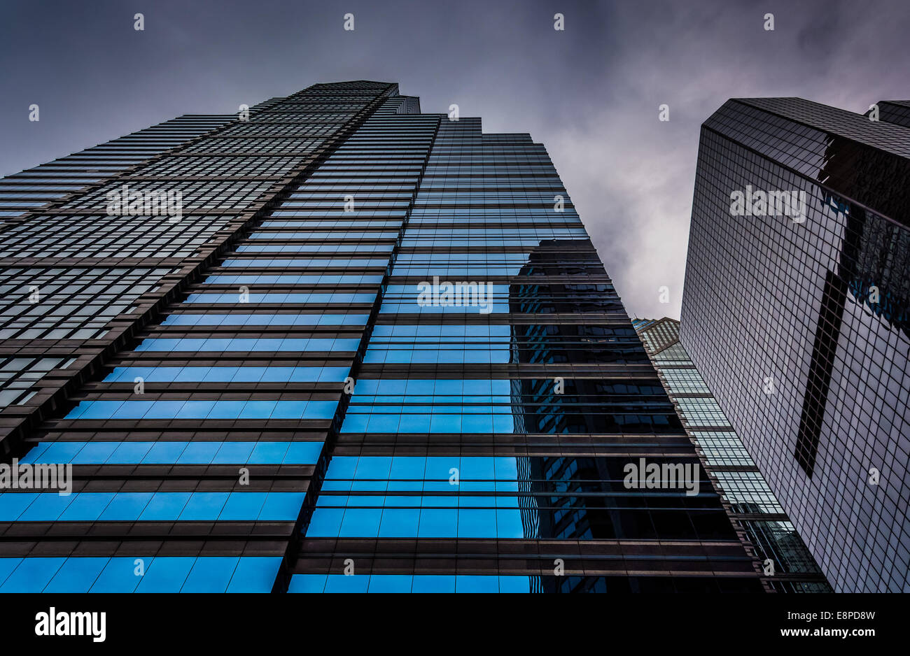 Looking up at modern buildings under a cloudy sky in Philadelphia ...