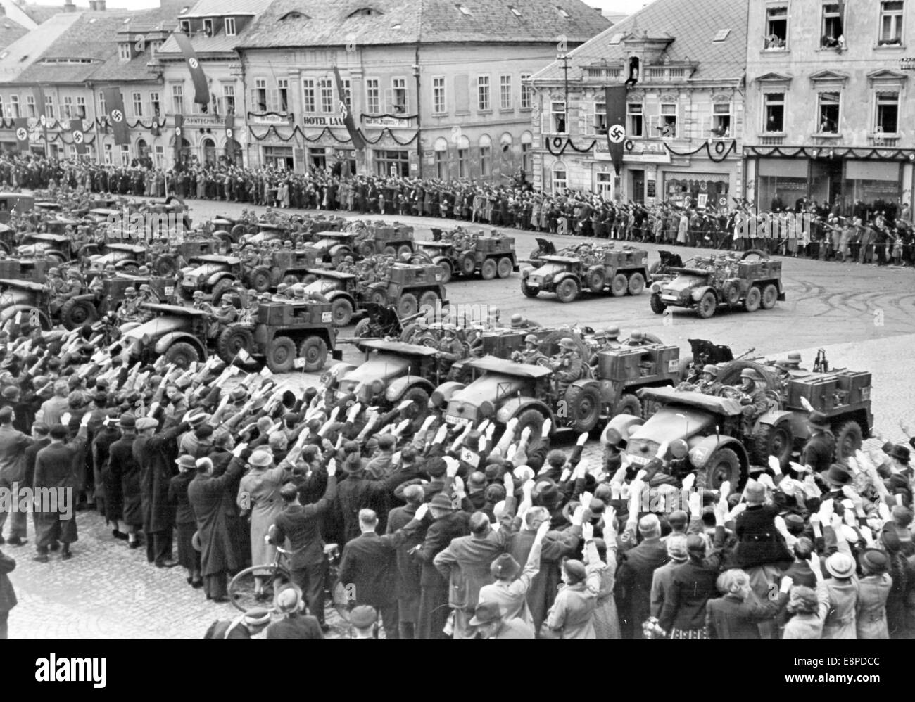 The picture from a Nazi news report shows the reception of the German Wehrmacht in Schluckenau, Sudetenland (today Sluknov, Czech Republic), October 1938. The Nazi news report written on the back of the picture reads: 'The first pictures of the arrival of German troops in the Sudentenland (2nd division). On market square in festively decorated Schluckenau, motorized groups have arrived to the delightment of the residents.' Fotoarchiv für Zeitgeschichtee - NO WIRE SERVICE Stock Photo