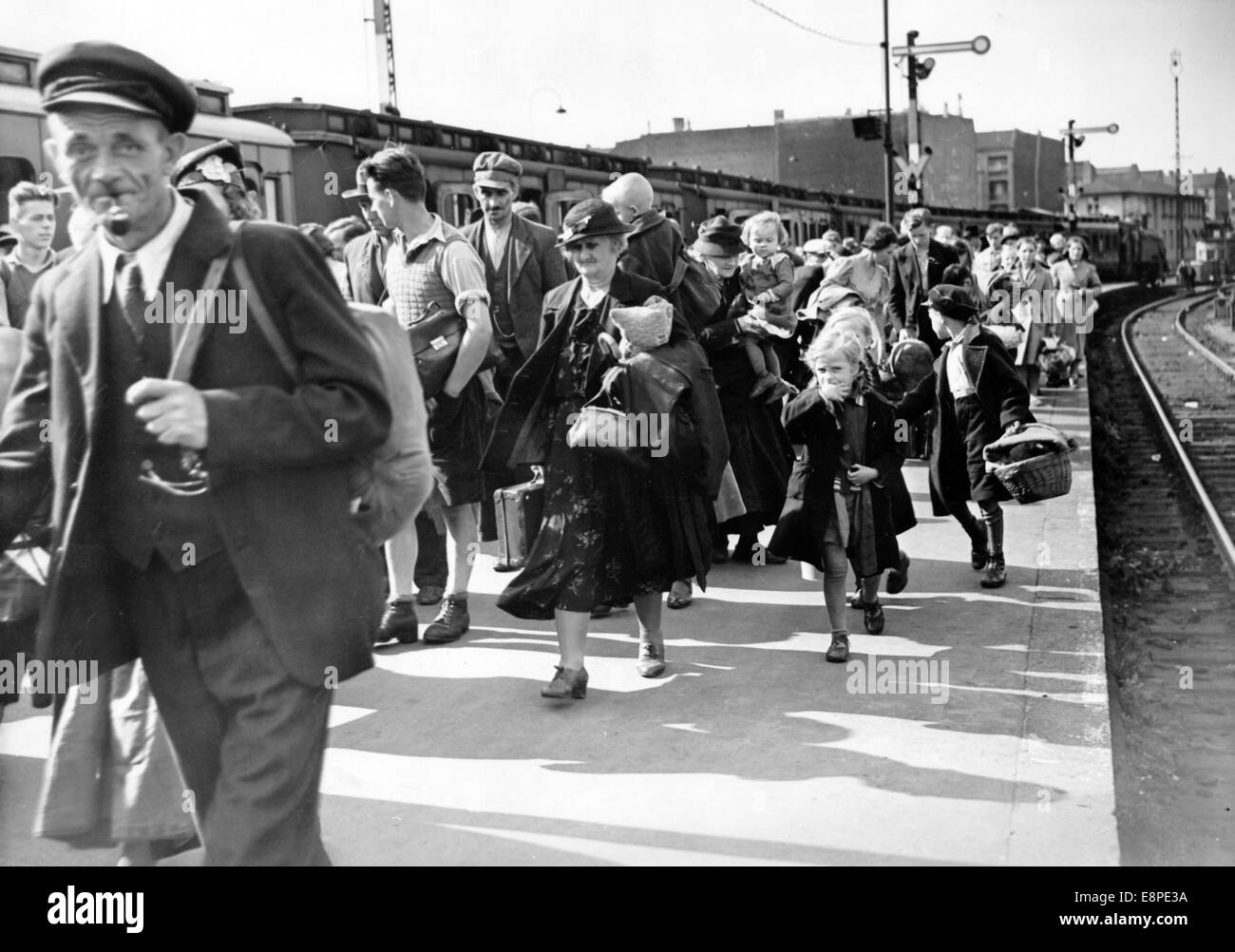The Nazi propaganda picture shows Volkdeutsch people arriving at Stettin train station in August 1939. The Nazi news report on the back of the picture reads: 'The number of refugees from Poland increases constantly. The arrival of Volksdeutsch refugees at Stettin Station. The Volksdeutsche refugees are cared for immediately upon their arrival.' Fotoarchiv für Zeitgeschichtee - NO WIRE SERVICE Stock Photo