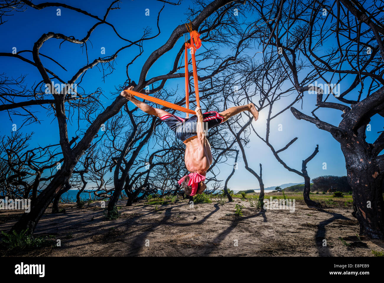 Man hanging upside down from hi-res stock photography and images - Alamy