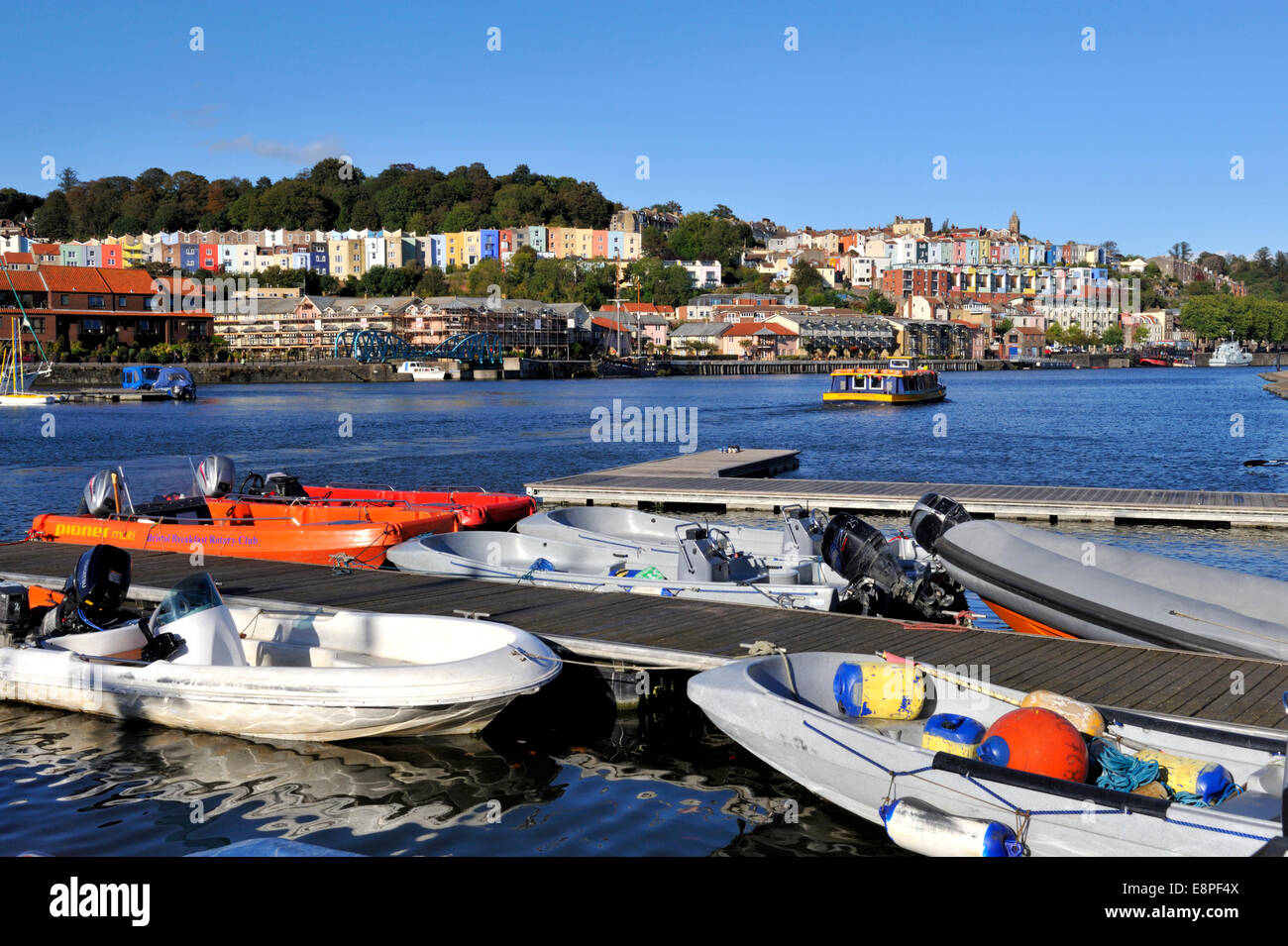 Bristol City Docks flouting harbour, boats moored in Underfall Yard by slipway with Hotwells and Clifton Wood in background, UK Stock Photo
