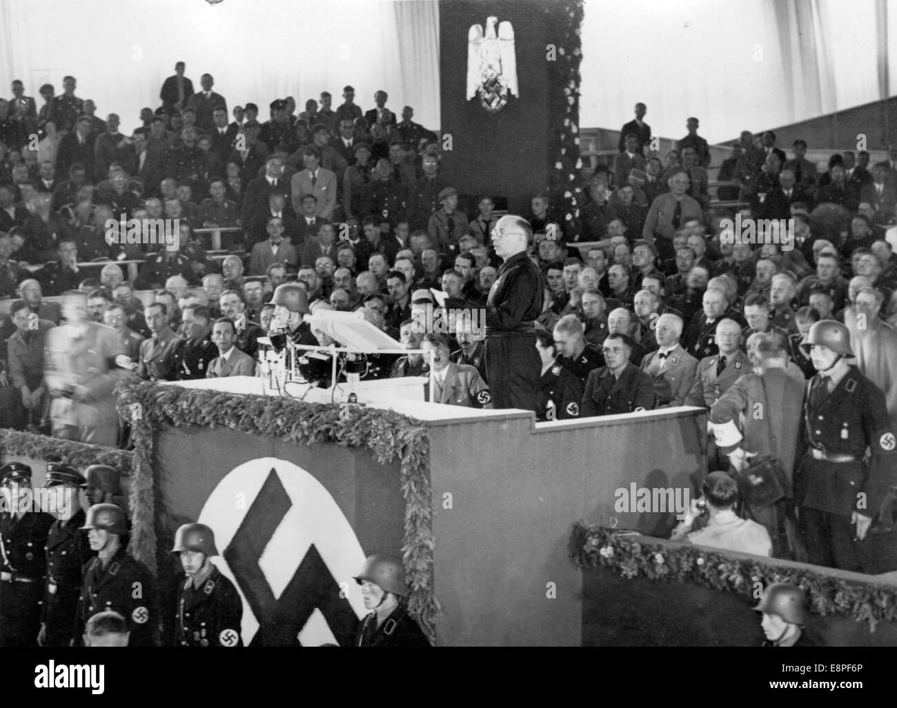 Nuremberg Rally 1933 in Nuremberg, Germany - Vice secretary of the Italian National Fascist Party (Partito Nazionale Fascista, PNF), Arturo Marcipati, conveys his party's greetings during the opening of the party congress in Luitpold Hall at the Nazi party rally grounds. To his left in the audience Adolf Hitler, left of the lectern Joseph Goebbels. (Flaws in quality due to the historic picture copy) Fotoarchiv für Zeitgeschichtee - NO WIRE SERVICE – Stock Photo