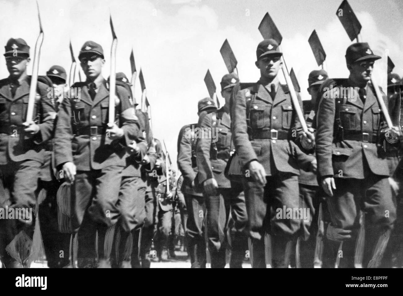 Nuremberg Rally 1934 in Nuremberg, Germany - Members of the Reich Labour Service (RAD) march with spades in their hands. Still from the propaganda film 'Triumph of the Will'. (Flaws in quality due to the historic picture copy) Fotoarchiv für Zeitgeschichtee - NO WIRE SERVICE - Stock Photo