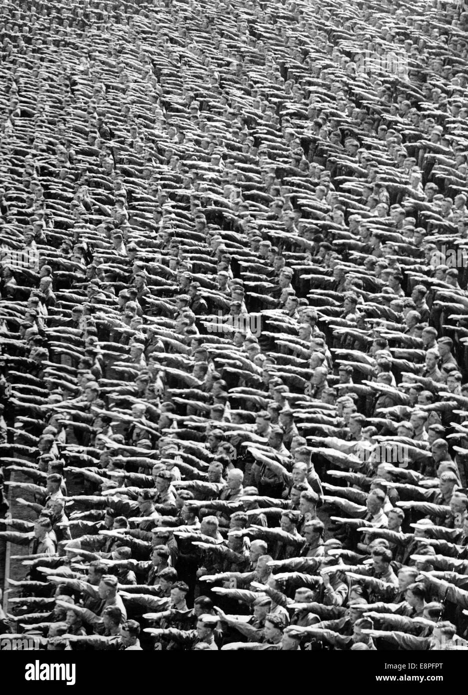 Nuremberg Rally 1935 in Nuremberg, Germany - Members of the Hitler Youth (HJ) perform the Nazi salute at the Nazi party rally grounds. (Flaws in quality due to the historic picture copy) Fotoarchiv für Zeitgeschichtee - NO WIRE SERVICE - Stock Photo