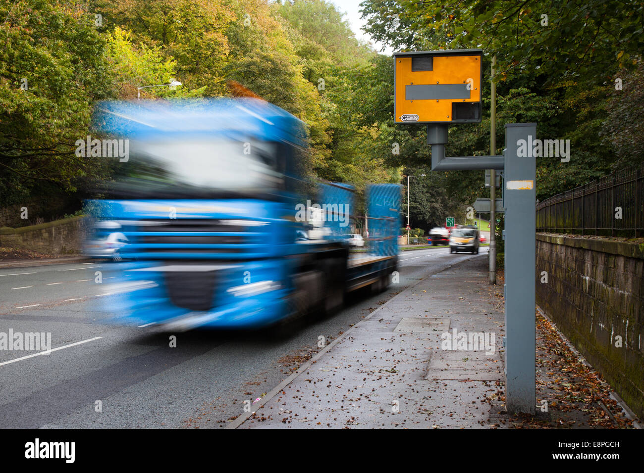 Blurred Moving traffic; Road vehicles speeding passing Gatso Meter, Traffic Speed Camera, City Centre Penwortham, Preston, Lancashire, UK Stock Photo