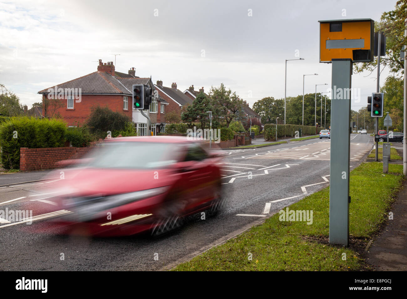 Blurred Moving traffic; Road vehicles speeding passing Gatso Meter, Traffic Speed Camera, City centre Penwortham, Preston, Lancashire, UK Stock Photo