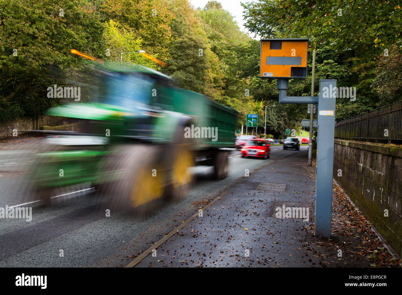 Blurred Moving traffic; Road vehicles speeding passing Gatso Meter, Traffic Speed Camera, City centre Penwortham, Preston, Lancashire, UK Stock Photo