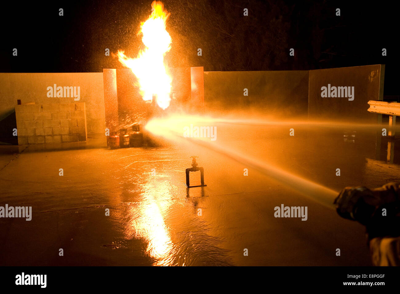 firefighters attack a gas fire Stock Photo