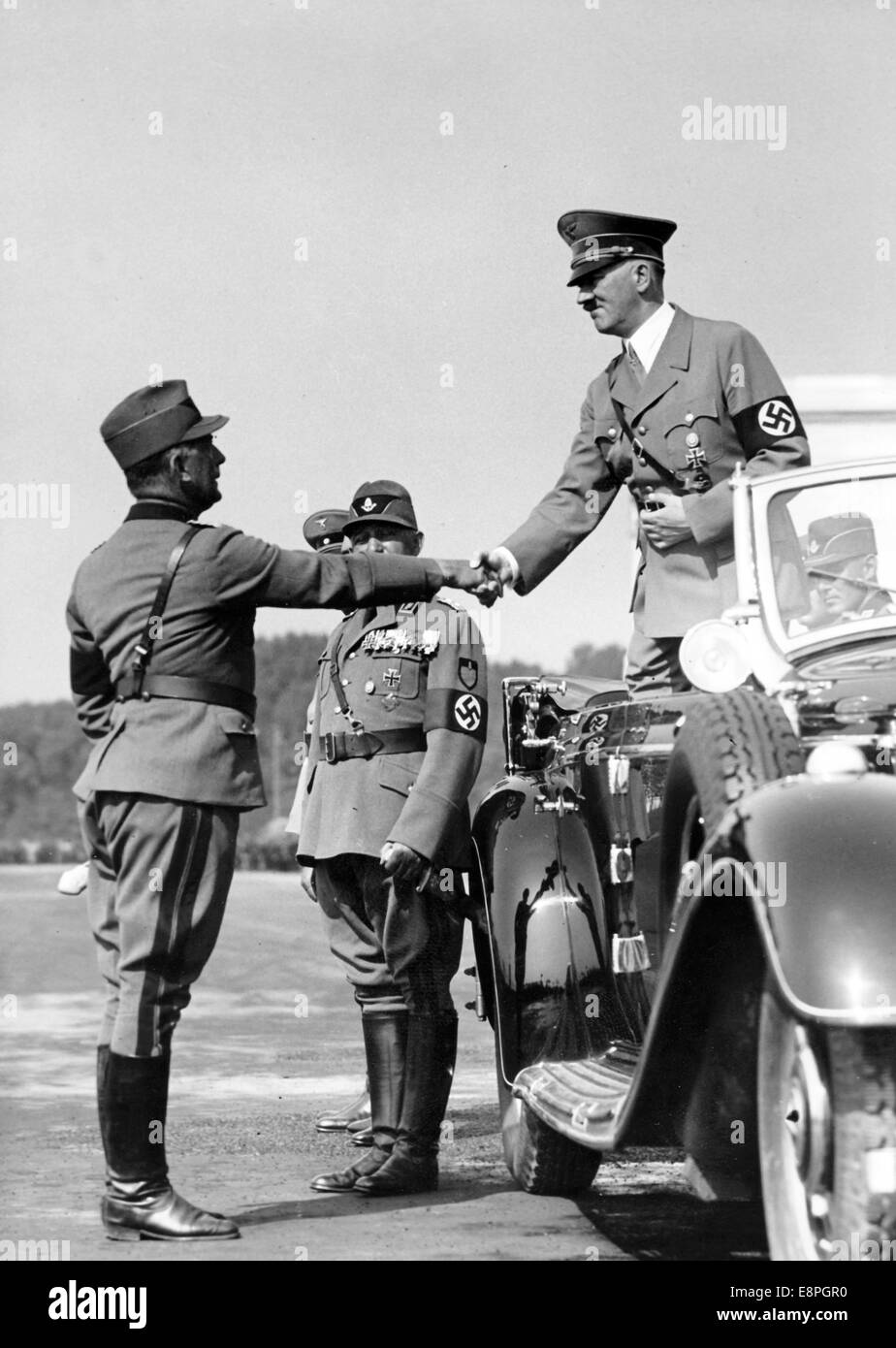 Nuremberg Rally 1937 in Nuremberg, Germany - Adolf Hitler shakes hands with a leader of the Reich Labour Service (RAD) during the grand march-past of the RAD at the Nazi party rally grounds. (Flaws in quality due to the historic picture copy) Fotoarchiv für Zeitgeschichtee - NO WIRE SERVICE - Stock Photo