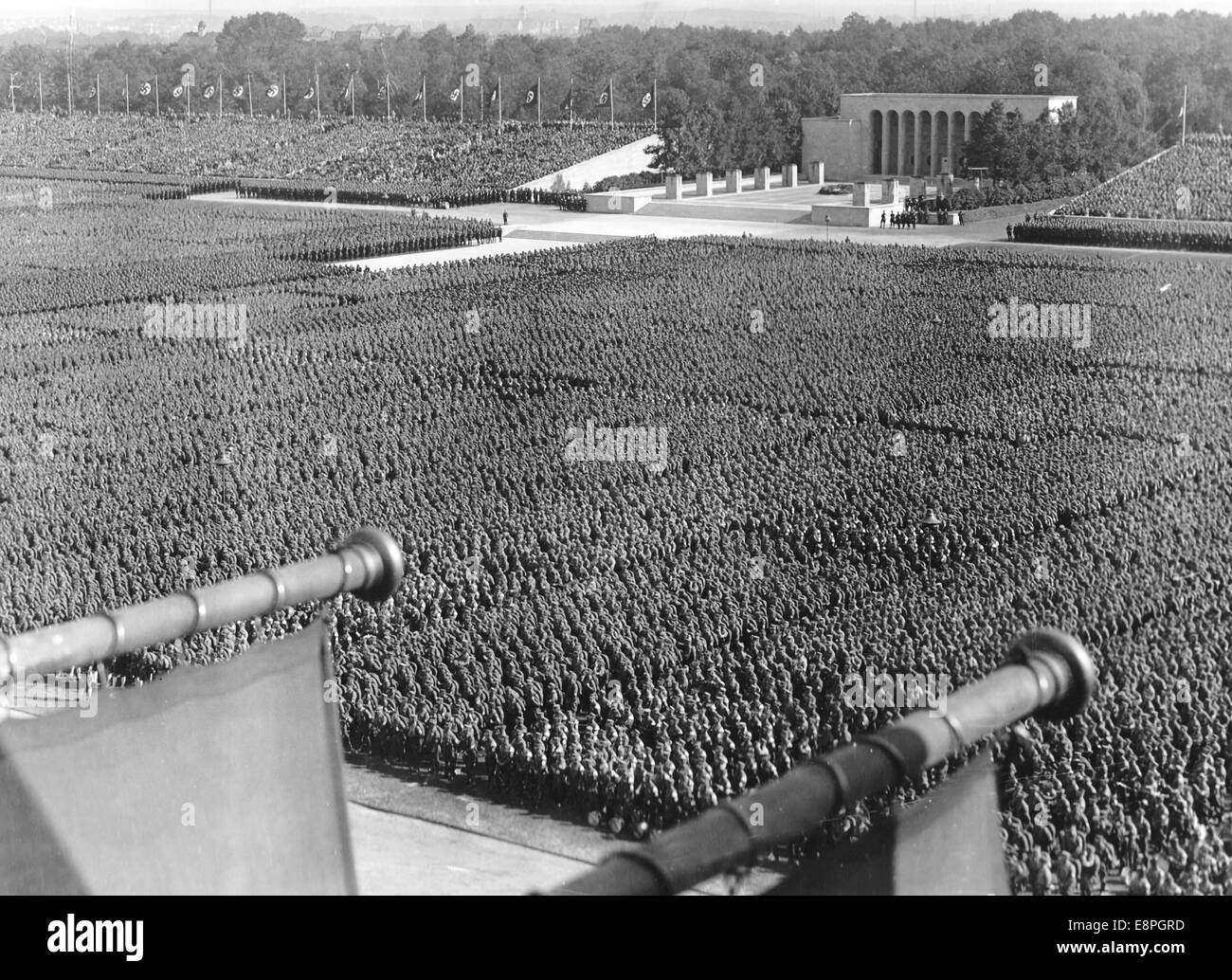 Nuremberg Rally 1937 in Nuremberg, Germany - Nazi party rally grounds - Sturmabteilung (SA) and Schutstaffel (SS) have taken up position at Luitpoldarena. The Hall of Honour can be seen in the background. (Flaws in quality due to the historic picture copy) Fotoarchiv für Zeitgeschichtee - NO WIRE SERVICE - Stock Photo