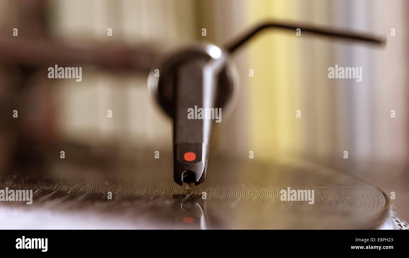 Dj needle stylus on spinning record, vinyl background Stock Photo - Alamy
