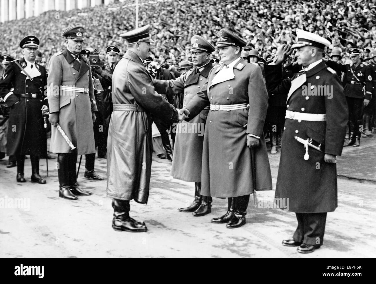 Nuremberg Rally 1937 in Nuremberg, Germany - Nazi party rally grounds - Adolf Hitler greets the commanders-in-chief of the branches of the German Wehrmacht (armed forces) on the occasion of the Wehrmacht demonstrations on Zeppelin Field. L-R General admiral Erich Raeder, colonel general Hermann Goering and colonel general Freiherr Werner von Fritsch. To the left of Hitler: Reich Minister of War field marshal Werner von Blomberg (2-L) and chief aid and adjutant of Hitler Julius Schaub (L). (Flaws in quality due to the historic picture copy) Fotoarchiv für Zeitgeschichtee - NO WIRE SERVICE - Stock Photo