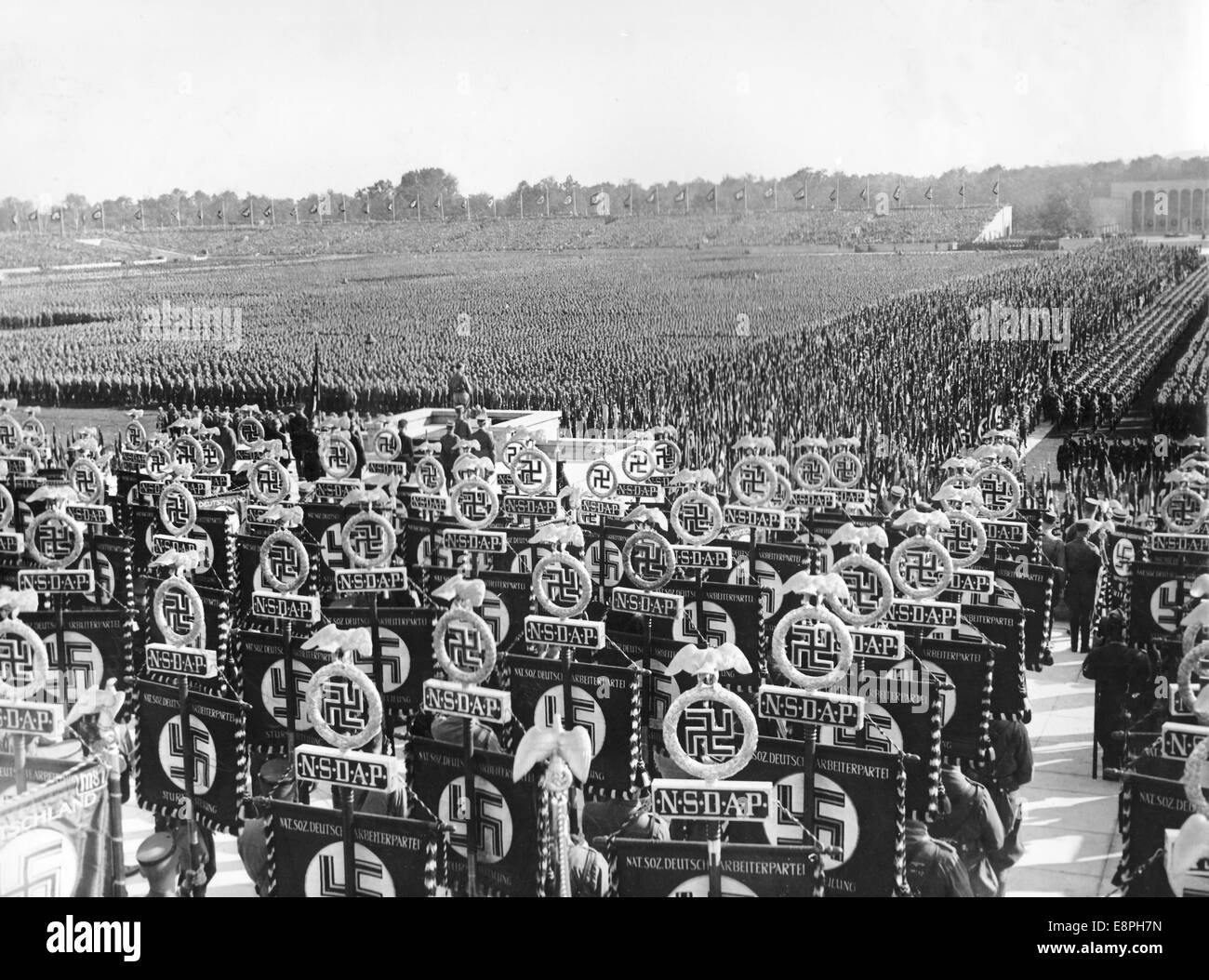 Nuremberg Rally 1936 in Nuremberg, Germany - Nazi party rally grounds - View of the formations of Sturmtruppe (SA), Schutzstaffel (SS) and National Socialist Motor Corps (NSKK). Adolf Hitler stands on the speaker's platform. (Flaws in quality due to the historic picture copy) Fotoarchiv für Zeitgeschichtee - NO WIRE SERVICE - Stock Photo