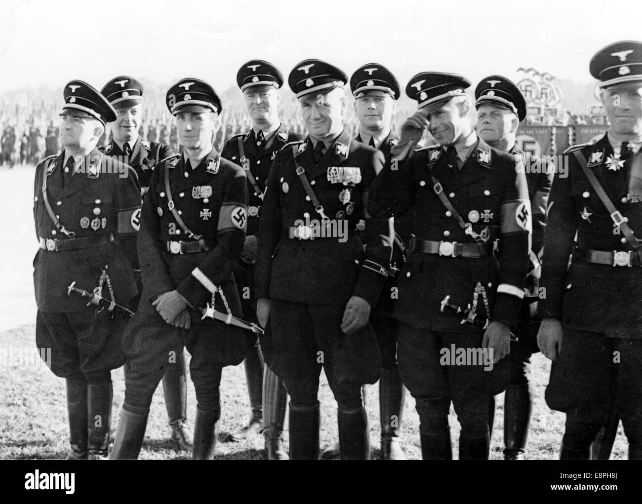 Nuremberg Rally 1937 in Nuremberg, Germany - Nazi party rally grounds - SS-Obergruppenfuehrer and Munich's chief of police Karl von Eberstein (2nd row, left) and SS-Gruppenfuehrer Theodor Berkelmann during the roll call of the Sturmabteilung (SA), Schutzstaffel (SS), National Socialist Motor Corps (NSKK) and National Socialist Flyers Corps (NSFK) at Luitpold arena. (Flaws in quality due to the historic picture copy) Fotoarchiv für Zeitgeschichtee - NO WIRE SERVICE - Stock Photo
