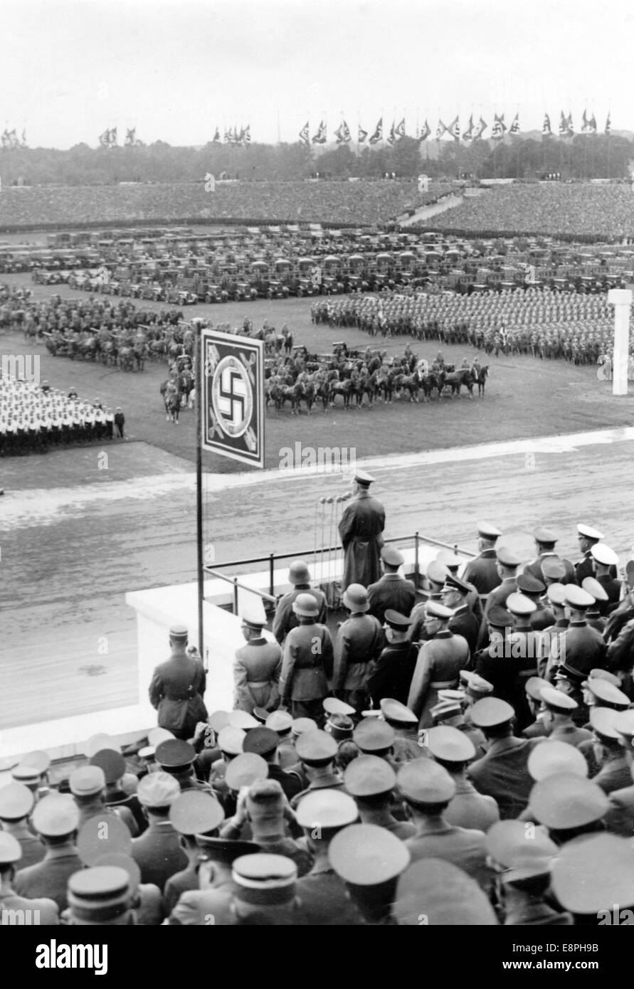 Nuremberg Rally 1937 in Nuremberg, Germany - Nazi party rally grounds - Demonstration by the Nazi armed forces (Wehrmacht) on Zeppelin Field, here speech by Adolf Hitler. On the right behind Hitler: Minister of War General Field Marshal Werner von Blomberg. (Flaws in quality due to the historic picture copy) Fotoarchiv für Zeitgeschichtee - NO WIRE SERVICE - Stock Photo