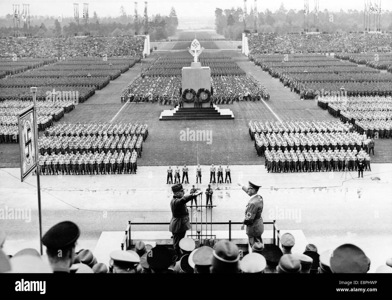 Nuremberg Rally in Nuremberg, Germany - Head of the Reich labour Service (RAD) Konstantin Hierl (L) reports 40,000 male members of the RAD and 2,000 female members of the RAD fallen in for roll call to Adolf Hitler on Zeppelin Field at the Nazi party rally grounds. (Flaws in quality due to the historic picture copy) Fotoarchiv für Zeitgeschichtee - NO WIRE SERVICE - Stock Photo