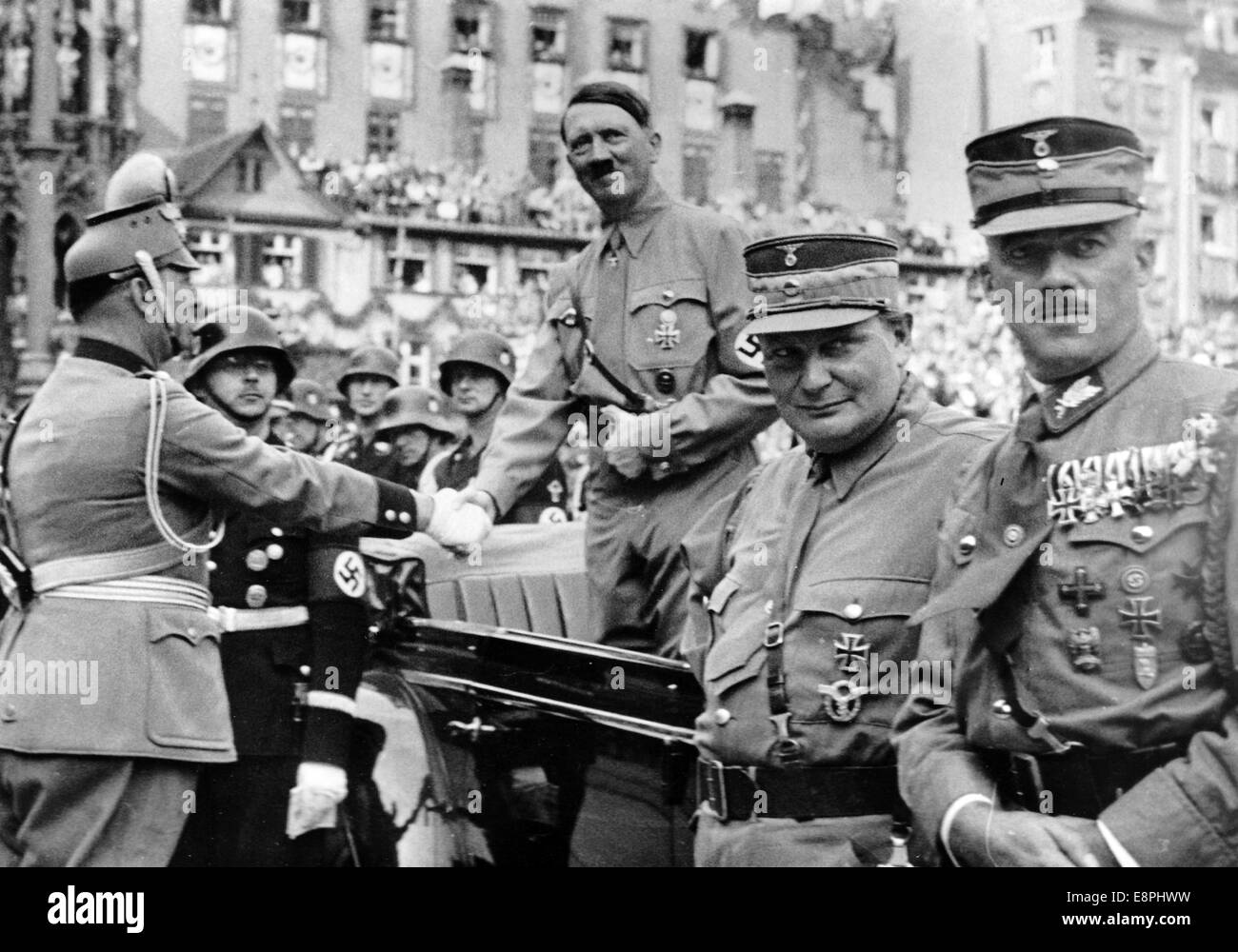 Nuremberg Rally 1938 in Nuremberg, Germany - Adolf Hitler greets Chief of the German Police Kurt Daluege on the occasion of the march-past of the police on Adolf-Hitler-Square. On the left Reichsfuehrer of the Schutzstaffel (SS) Heinrich Himmler. On the right Reich Minister Hermann Goering and Schustzstaffel (SA) official Franz von Pfeffer (R). (Flaws in quality due to the historic picture copy) Fotoarchiv für Zeitgeschichtee - NO WIRE SERVICE - Stock Photo