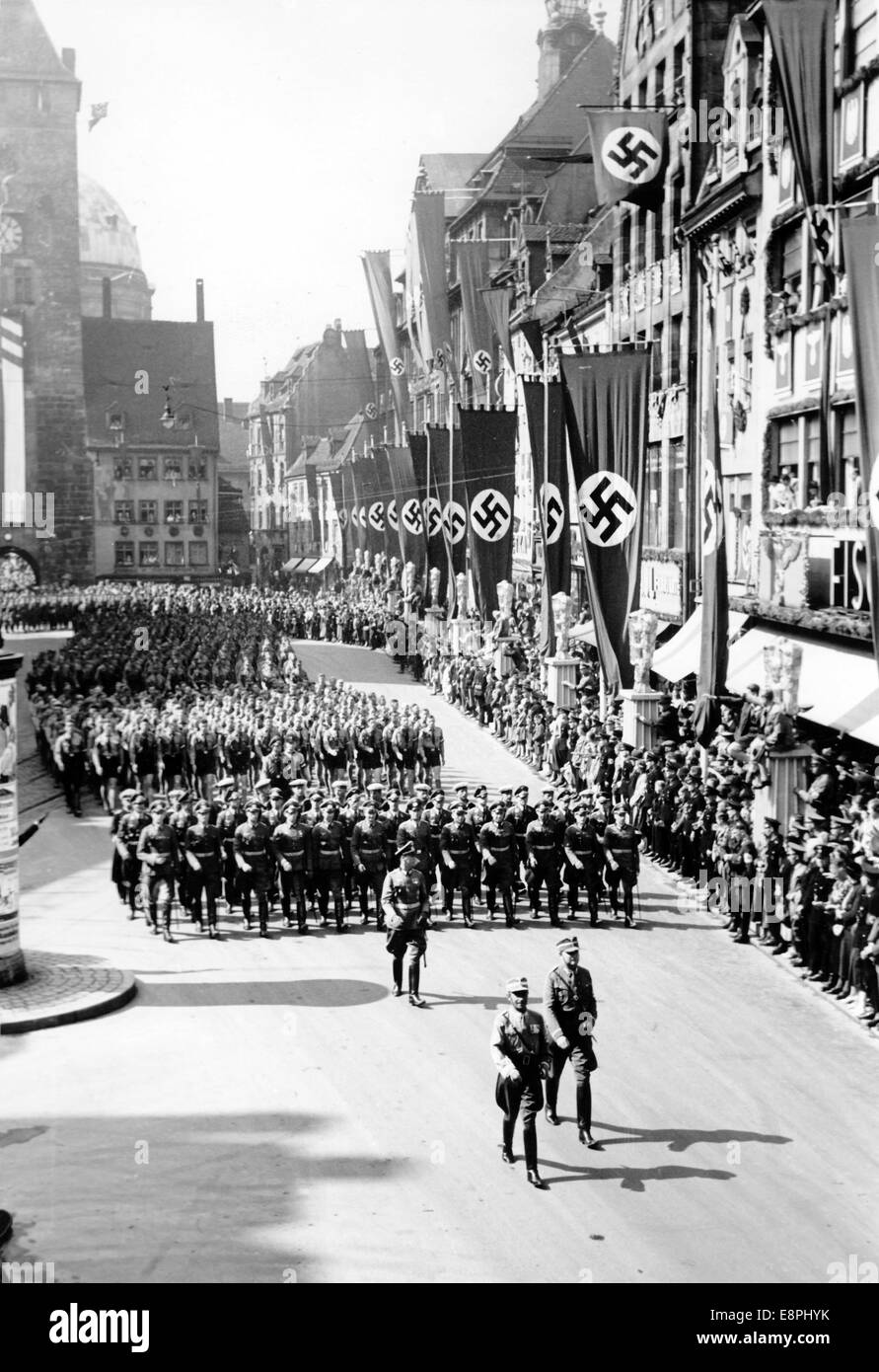 Nuremberg Rally 1938 in Nuremberg, Germany - So-called 'March of the 120,000' (selected members of the NSDAP and their groups) on Adolf-Hitler-Square (hauptmarkt), here Reich Sports Leader Hans von Tschammer und Osten ahead of the winners of the paramilitary sports and Hitler Youth competitions. (Flaws in quality due to the historic picture copy) Fotoarchiv für Zeitgeschichtee - NO WIRE SERVICE - Stock Photo