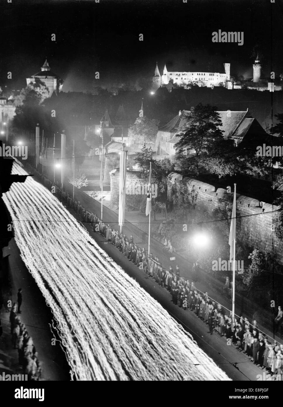 Nuremberg Rally 1938 in Nuremberg, Germany - Great torchlight procession of the political leaders at the Frauentormauer (lit: Women's Gate wall). (Flaws in quality due to the historic picture copy) Fotoarchiv für Zeitgeschichtee - NO WIRE SERVICE - Stock Photo