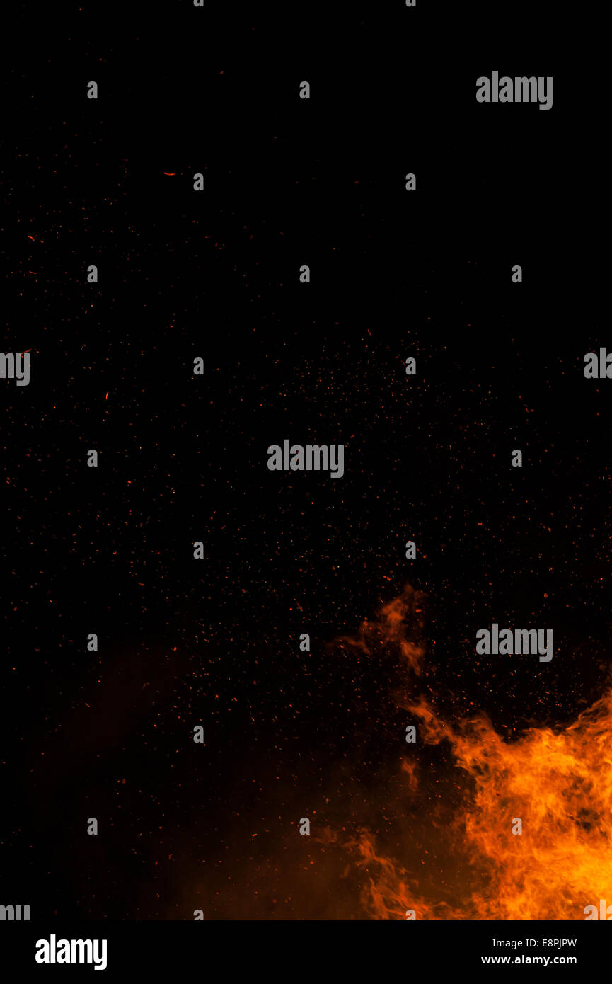 Large bonfire against a black night's sky making incredible shapes Stock Photo