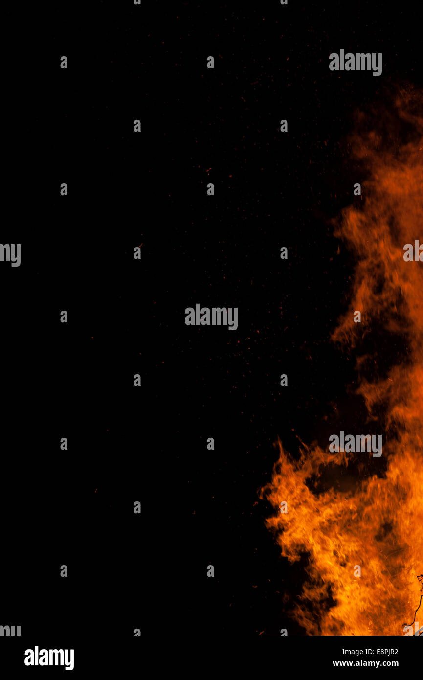 Large bonfire against a black night's sky making incredible shapes Stock Photo