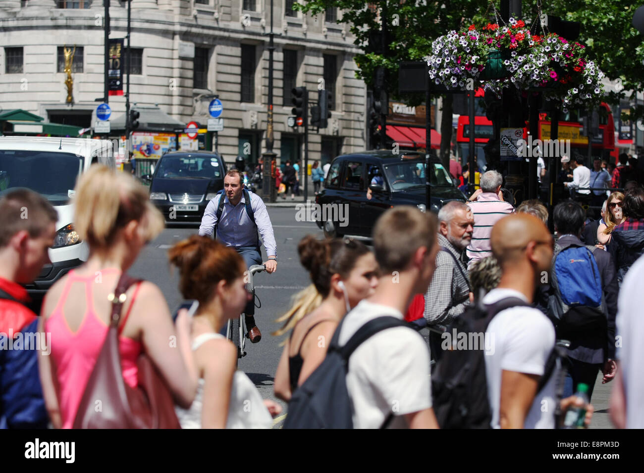 People crossing a road in London - traffic in the background Stock Photo