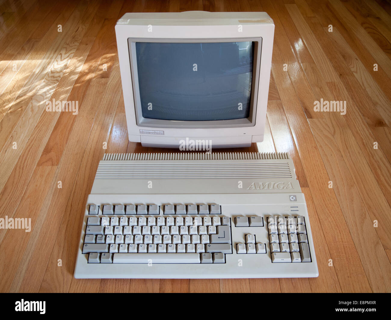 A view of a Commodore Amiga 500 computer and a Commodore 1084S computer monitor. Stock Photo