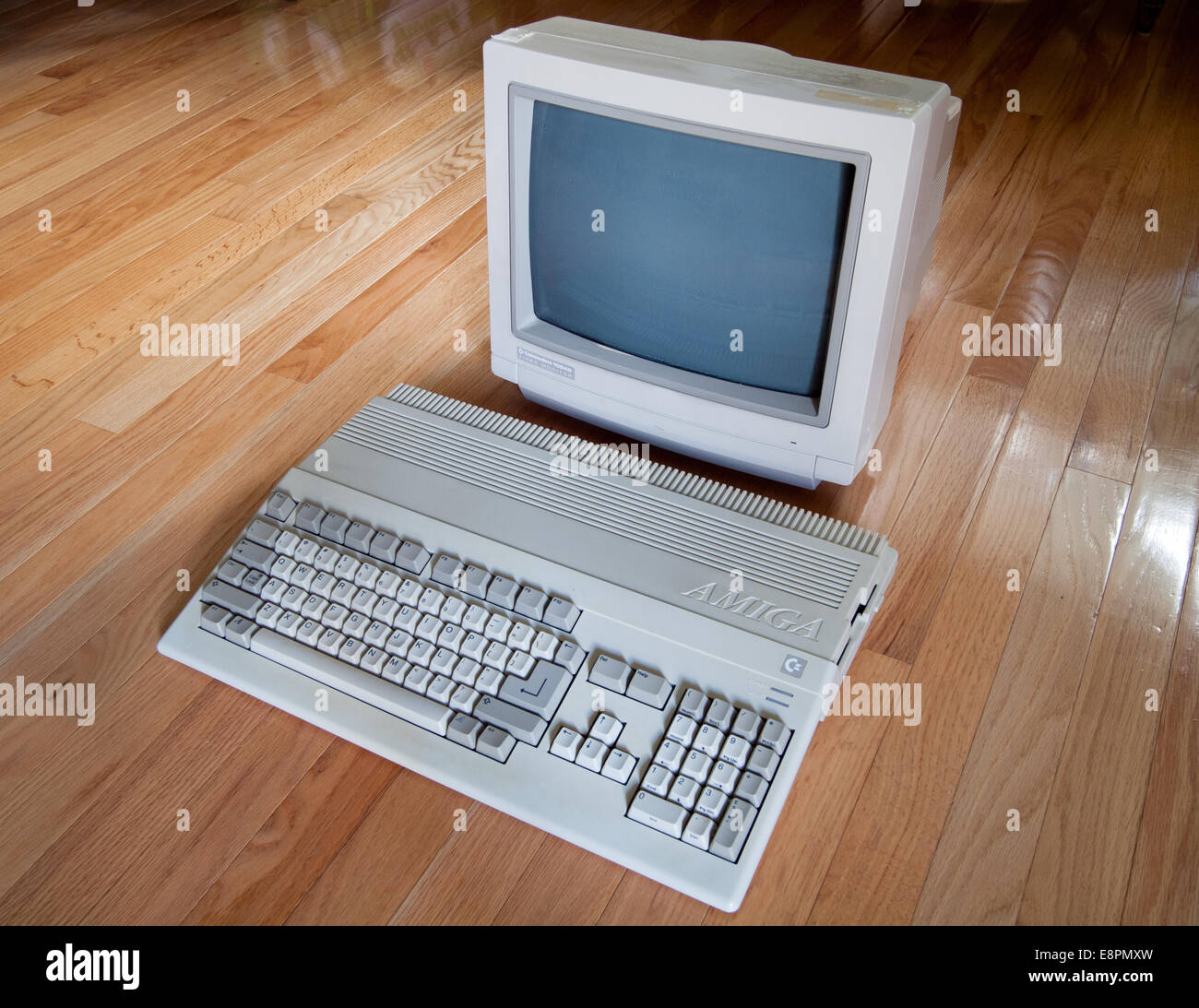 A view of a Commodore Amiga 500 computer and a Commodore 1084S computer monitor. Stock Photo