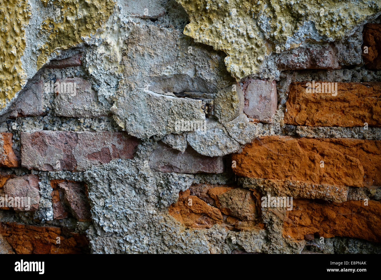 Old brick wall in a rundown house, background Stock Photo
